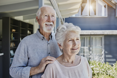 Senoir couple standing in their home, looking confident stock photo