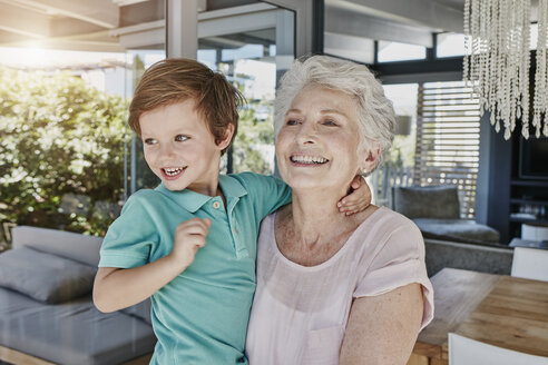 Grandson and grandmother playing with toy airplane - RORF00510