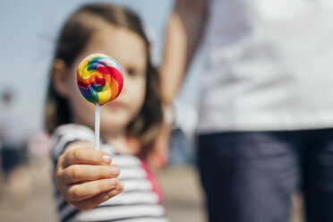 USA, New York, Coney Island, little girl's hand holding lollipop, close-up - DAPF00550