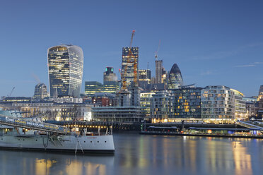 UK, London, skyline with office towers and HMS Belfast museum ship at dusk - GF00938