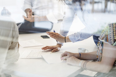 Business meeting in conferene room behind glass wall - PESF00472