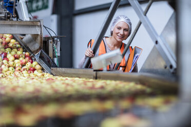 Female inspector in food processing plant - ZEF12429