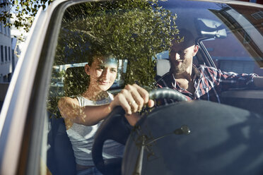 Young couple driving in a car - SRYF00211