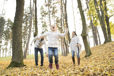 Happy girl with family in autumnal forest - HAPF01317