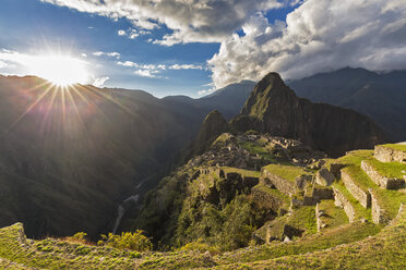 Peru, Andes, Urubamba Valley, Machu Picchu with mountain Huayna Picchu at sunset - FOF08765