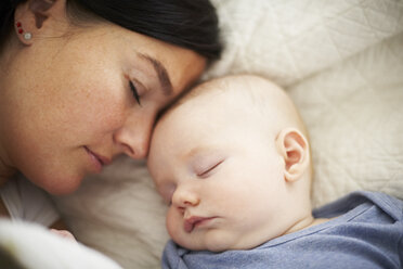 Mother and baby sleeping in bed - FSF00657