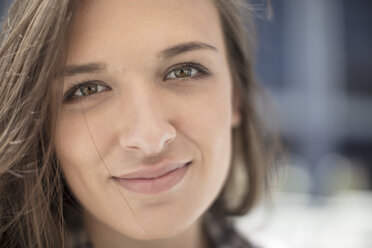 Portrait of young woman smiling - ZEF12480