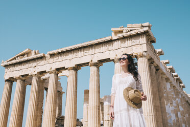 Greece, Athens, smiling woman visiting the Parthenon temple on the Acropolis - GEMF01409