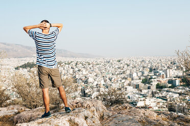 Greece, Athens, tourist looking at the city from Areopagus - GEMF01424