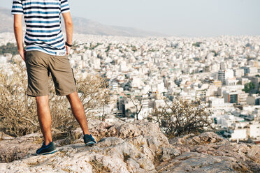 Greece, Athens, tourist looking at the city from Areopagus - GEMF01425