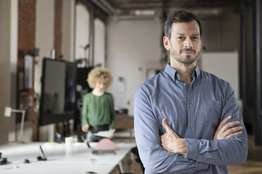 Portrait of confident businessman in office - RBF05585