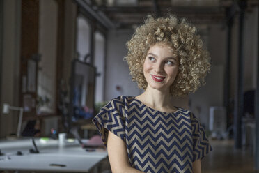 Portrait of smiling woman in office - RBF05593