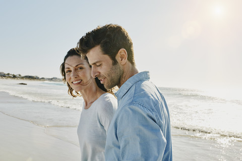 Couple on the beach stock photo