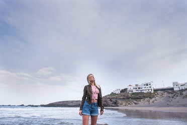 Spain, Tenerife, young blond woman on the beach - SIPF01359