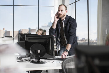 Man on the phone in office - ZEF12554