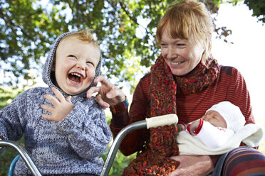 Happy mother with son and baby in the nature - FSF00672