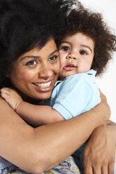 Portrait of little boy cuddling with his mother - FSF00696