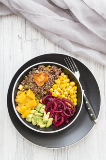 Lunch bowl of red quinoa, beetroot, corn, avocado, orange and vegetable chips - SARF03149