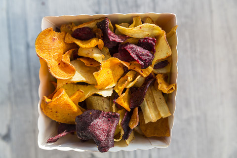 Vegetable chips with pyramide salt stock photo