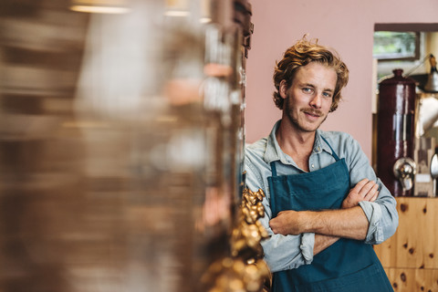 Portrait of confident coffee roaster in his shop stock photo