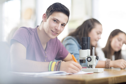 Portrait of smiling science student in class stock photo