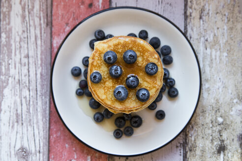 Dish with pile of pancakes and blueberries with maple sirup - SARF03165