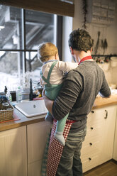 Father and baby boy in kitchen washing dishes - HAPF01338