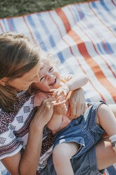 Mother tickling her little daughter - DWF00277