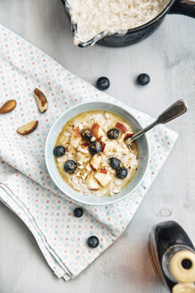 Vegan coconut milk porridge with blueberries, apple, brazil nuts and cinnamon - IPF00356