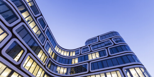 Facade of lighted office building in the evening - WDF03863