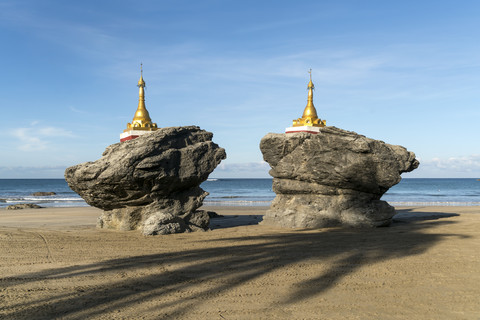 Myanmar, pagodas at the beach of Ngwesaung stock photo