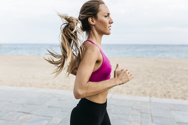 Young woman running at the beach - GIOF01722