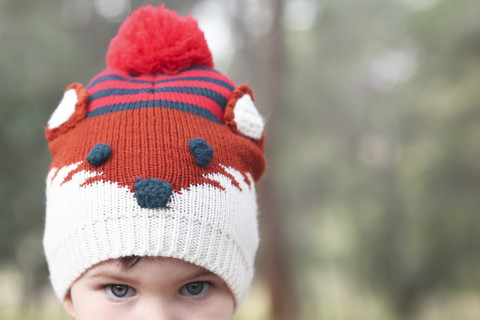 Close-up of boy wearing funny wooly hat stock photo