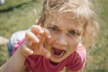 Portrait of girl pretending to be a wild animal - JOSF00583