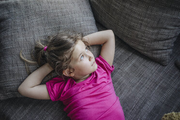 Portrait of girl lying on couch - JOSF00593