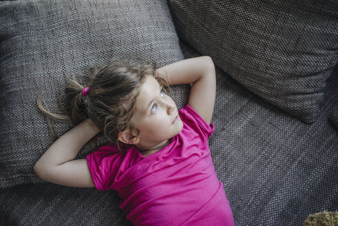 Portrait of girl lying on couch - JOSF00593