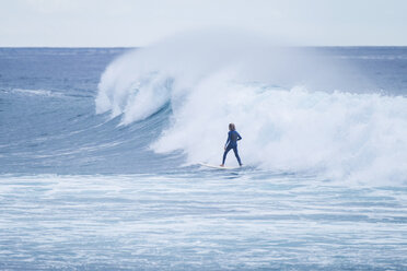 Spain, Tenerife, Teenage boy surfing on sea - SIPF01398