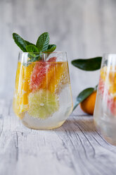 Two glasses of detox water infused with citrus fruits - SARF03181