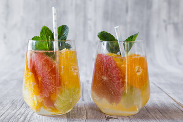 Two glasses of detox water infused with citrus fruits - SARF03183