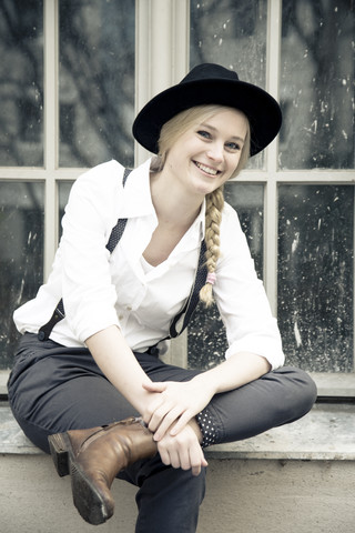 Portrait of smiling young woman wearing vintage clothing stock photo