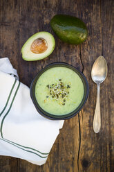 Bowl of avocado cucumber soup garnished with sprouts - LVF05862