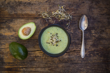 Bowl of avocado cucumber soup garnished with sprouts - LVF05863