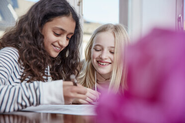 Two girls doing homework together - RHF01800