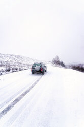 UK, Scotland, Glen Etive, Four wheel drive vehicle in winter - SMAF00664