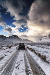 UK, Scotland, Glen Etive, Four wheel drive vehicle in winter - SMAF00671