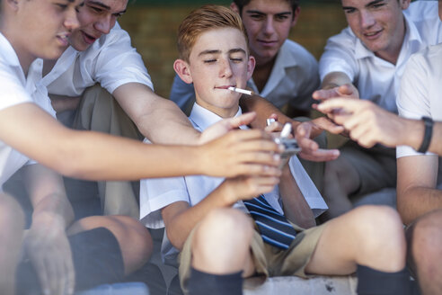 High school student offering cigarettes - ZEF12803