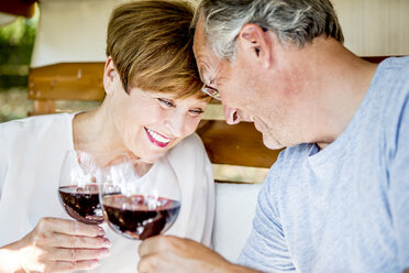 Happy senior couple having glass of red wine - WESTF22695