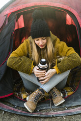 Young woman in tent - KKAF00409