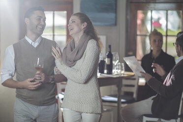 Happy couple with glass of wine - ZEF12860