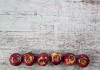 Row of six red apples - JUNF00855